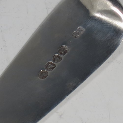 Antique Georgian sterling silver fish server slice, having a plain Fiddle pattern handle, a hand-pierced asymmetrical and curved blade, and a hand-engraved reeded border. Made by William Eley of London in 1838. The dimensions of this fine hand-made silver fish serving slice are length 30 cms (11.75 inches), and it weighs approx. 140g (4.5 troy ounces).
