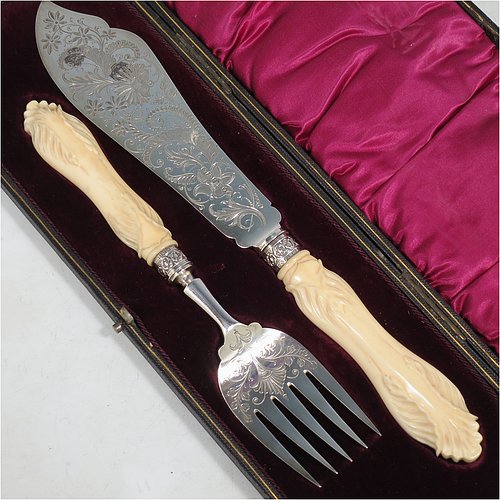An Antique Victorian Sterling Silver fish serving knife and fork set, having hand-carved bone handles, with hand-engraved blade and tines with floral decoration, all in their original maroon satin and velvet-lined presentation box. Made by Robert Fead Mosley of Sheffield in 1894. The dimensions of this fine hand-made antique silver and bone-handled fish serving set are length of knife 32 cms (12.5 inches), and length of fork 24 cms (9.5 inches).   