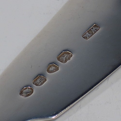 A very pretty and rare Antique Victorian Sterling Silver fish server slice, in the Fiddle pattern with an asymmetrical curved blade, having hand-engraved floral decoration together with hand-pierced fish and acorn work. Made by William Knight of London in 1845. The dimensions of this fine hand-made antique silver fish serving slice are length 30.5 cms (12 inches), and it weighs approx. 112g (3.6 troy ounces).
	   