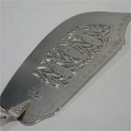 A very pretty and rare Antique Victorian Sterling Silver fish server slice, in the Fiddle pattern with an asymmetrical curved blade, having hand-engraved floral decoration together with hand-pierced fish and acorn work. Made by William Knight of London in 1845. The dimensions of this fine hand-made antique silver fish serving slice are length 30.5 cms (12 inches), and it weighs approx. 112g (3.6 troy ounces).
	   