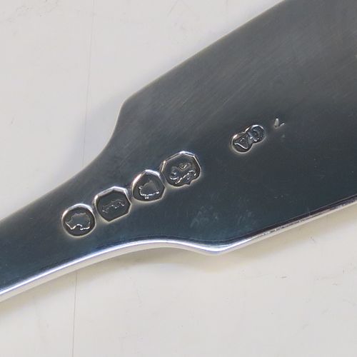 A very elegant Antique Victorian Sterling Silver fish serving fork, in the Fiddle pattern with hand-pierced floral decoration below the tines. This handsome antique silver serving fork was made by George Adams of London in 1861. The dimensions of this fine hand-made antique silver serving fork are length 25.5 cms (10 inches), and it weighs approx. 110g (3.5 troy ounces).