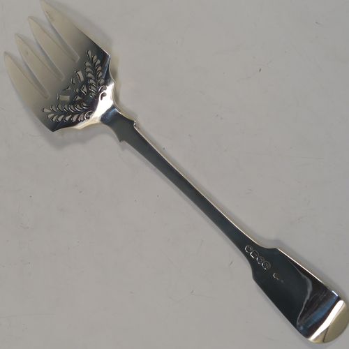 A very elegant Antique Victorian Sterling Silver fish serving fork, in the Fiddle pattern with hand-pierced floral decoration below the tines. This handsome antique silver serving fork was made by George Adams of London in 1861. The dimensions of this fine hand-made antique silver serving fork are length 25.5 cms (10 inches), and it weighs approx. 110g (3.5 troy ounces).