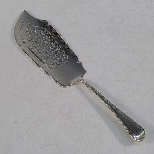 A very pretty Antique Victorian Sterling Silver fish server slice, in the double-struck Bead pattern, with a hand-pierced asymmetrical and curved blade. Made by the Wintle Brothers of Exeter in 1872. The dimensions of this fine hand-made antique silver fish serving slice are length 31 cms (12.25 inches), and it weighs approx. 181g (5.8 troy ounces).  