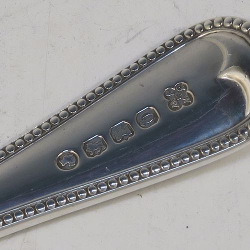 A very pretty Antique Victorian Sterling Silver fish server slice, in the double-struck Bead pattern, with a hand-pierced asymmetrical and curved blade. Made by the Wintle Brothers of Exeter in 1872. The dimensions of this fine hand-made antique silver fish serving slice are length 31 cms (12.25 inches), and it weighs approx. 181g (5.8 troy ounces).  