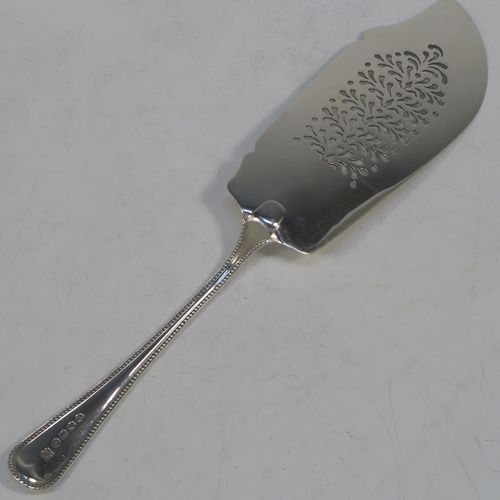 A very pretty Antique Victorian Sterling Silver fish server slice, in the double-struck Bead pattern, with a hand-pierced asymmetrical and curved blade. Made by the Wintle Brothers of Exeter in 1872. The dimensions of this fine hand-made antique silver fish serving slice are length 31 cms (12.25 inches), and it weighs approx. 181g (5.8 troy ounces).  
