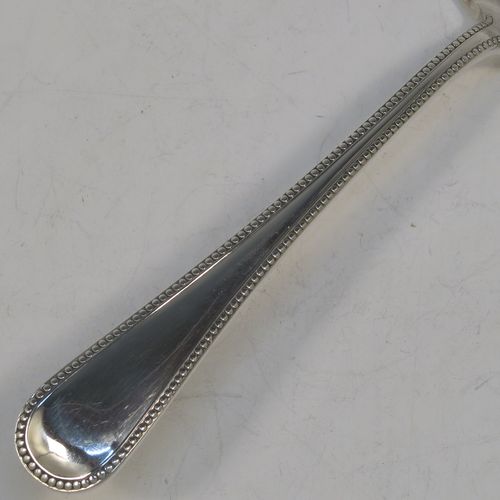 A very pretty Antique Victorian Sterling Silver fish server slice, in the double-struck Bead pattern, with a hand-pierced asymmetrical and curved blade. Made by the Wintle Brothers of Exeter in 1872. The dimensions of this fine hand-made antique silver fish serving slice are length 31 cms (12.25 inches), and it weighs approx. 181g (5.8 troy ounces).  