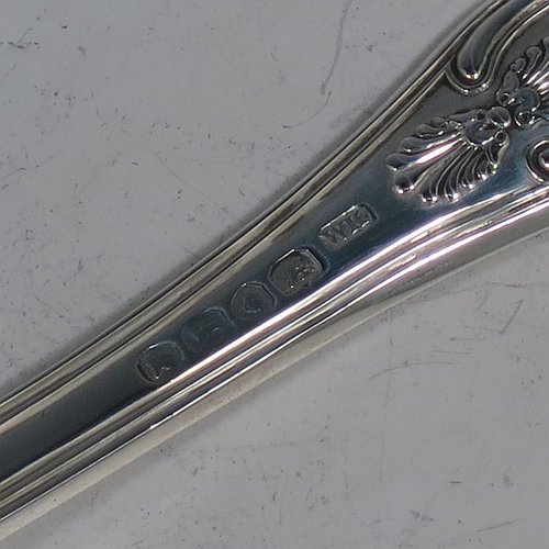 An Antique Georgian Sterling Silver fish server slice, having a double-struck Kings pattern handle, a hand-pierced asymmetrical and curved blade, and a hand-engraved reeded border. Made by William Knight of London in 1821. The dimensions of this fine hand-made antique silver fish serving slice are length 30 cms (11.75 inches), and it weighs approx. 154g (5 troy ounces).