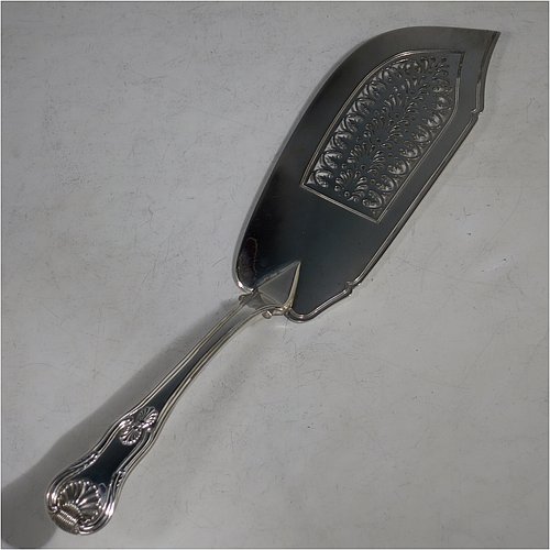 An Antique Georgian Sterling Silver fish server slice, having a double-struck Kings pattern handle, a hand-pierced asymmetrical and curved blade, and a hand-engraved reeded border. Made by William Knight of London in 1821. The dimensions of this fine hand-made antique silver fish serving slice are length 30 cms (11.75 inches), and it weighs approx. 154g (5 troy ounces).