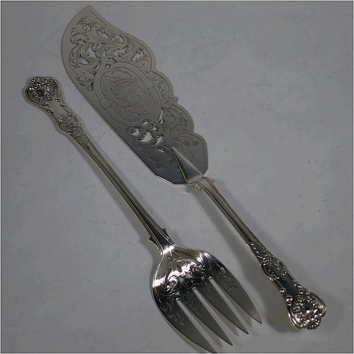 A very pretty Antique Victorian Sterling Silver fish serving knife and fork set, having handles in the double-struck Queens pattern, hand-pierced and hand-engraved with floral and leaf decoration, the blade with a cartouche engraved with a scene of a sea fishing vessel. Made by Thomas Hart Stone of Exeter in 1865. The dimensions of this fine hand-made antique silver fish serving set are length of knife 31 cms (12.25 inches), length of fork 25.5 cms (10 inches), and a total weight of 300g (9.7 troy ounces).   