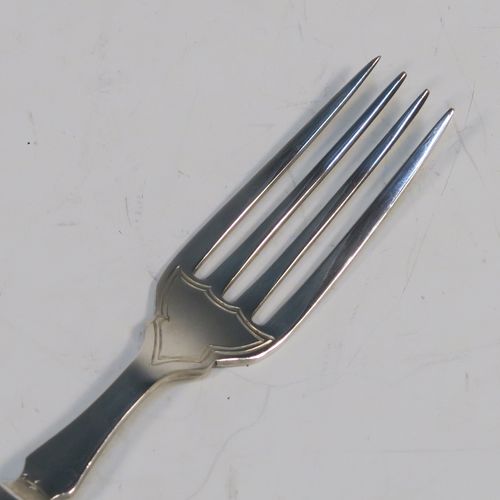 A very handsome Antique Sterling Silver and bone-handled fish set for twelve people, having hand-chased blades and tines with a pretty floral border thread, and fitted into their original dark blue velvet-lined oak presentation box. This elegant antique silver and bone-handled fish eating set was all made by Frederick Asman of Sheffield in 1921. The dimensions of these fine hand-made antique silver fish-eaters are length of knife 20 cms (8 inches), and fork 16.5 cms (6.5 inches).