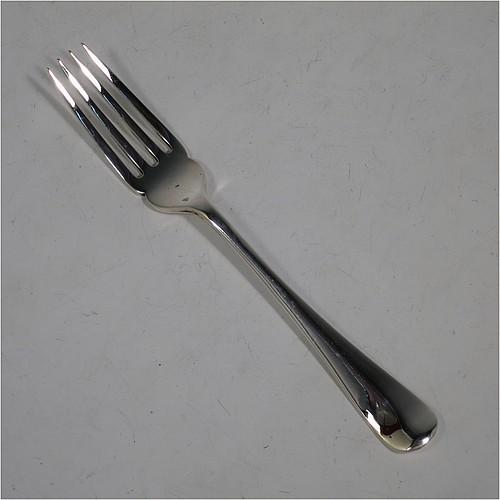 A very handsome Antique Edwardian Sterling Silver fish service set for twelve people, in the plain Hanoverian pattern, with four-prong forks and flat symmetrical bladed knives, fitted into their original dark blue velvet-lined oak presentation box. All made by Mappin and Webb of Sheffield in 1909. The dimensions of these fine hand-made antique silver fish-eaters are length of knife 20 cms (8 inches), and fork 17 cms (6.75 inches), with a total weight of approx. 1,310g (42 troy ounces). Please note that the small brass plaque on top of the boxes lid is missing.    
