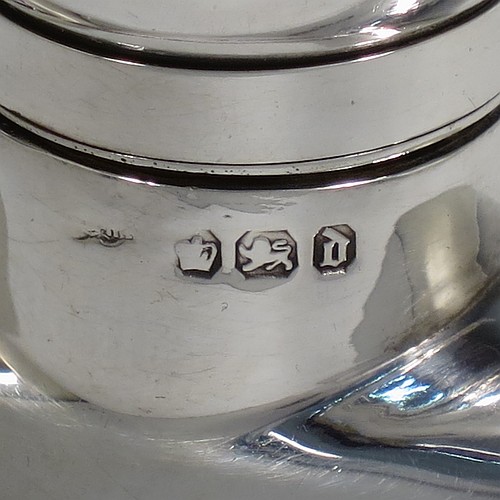 A very handsome Antique Victorian Sterling Silver whisky hip flask, having a plain shaped rectangular body with rounded shoulders, and a bayonet-fit lid. Made by Walker and Hall of Sheffield in 1896. The dimensions of this fine hand-made antique silver hip whisky flask are length 15 cms (6 inches), width 8 cms (3 inches), depth 3 cms (1.25 inch), and it weighs approx. 189g (6 troy ounces).
