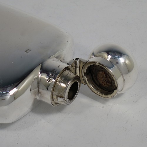 A very handsome Antique Victorian Sterling Silver whisky hip flask, having a plain shaped rectangular body with rounded shoulders, and a bayonet-fit lid. Made by Walker and Hall of Sheffield in 1896. The dimensions of this fine hand-made antique silver hip whisky flask are length 15 cms (6 inches), width 8 cms (3 inches), depth 3 cms (1.25 inch), and it weighs approx. 189g (6 troy ounces).