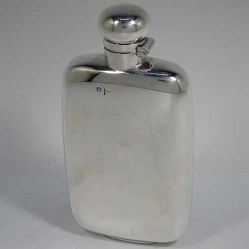 A very handsome Antique Victorian Sterling Silver whisky hip flask, having a plain shaped rectangular body with rounded shoulders, and a bayonet-fit lid. Made by Walker and Hall of Sheffield in 1896. The dimensions of this fine hand-made antique silver hip whisky flask are length 15 cms (6 inches), width 8 cms (3 inches), depth 3 cms (1.25 inch), and it weighs approx. 189g (6 troy ounces).