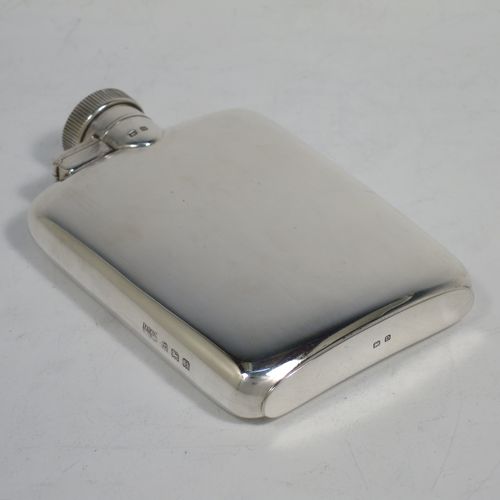 A handsome Sterling Silver whisky hip flask, having a plain shaped rectangular body with rounded shoulders, and a hinged bayonet-fit lid with knurled thumb-piece. Made by Mappin and Webb of Birmingham in 1928. The dimensions of this fine hand-made silver whisky flask are length 10 cms (4 inches), width 7 cms (2.75 inches), depth 2 cms (0.75 inches) and it weighs approx. 104g (3.4 troy ounces).    