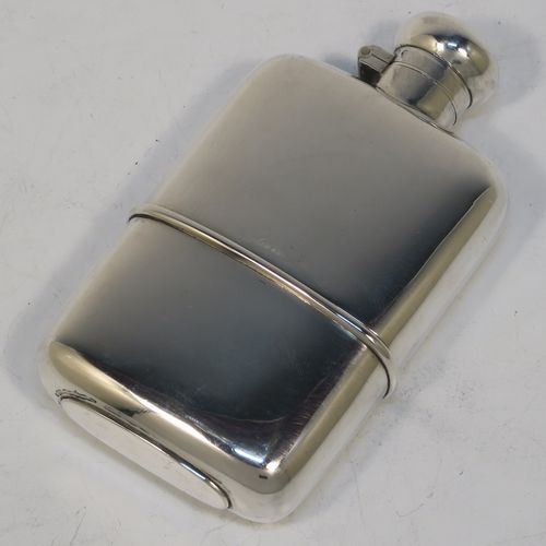 A very handsome Antique Edwardian Sterling Silver whisky hip flask, having a plain shaped rectangular body with rounded shoulders, a bayonet-fit lid, and a pull-off cup. Made by Marks and Cohen of Birmingham in 1905. The dimensions of this fine hand-made antique silver whisky flask are length 11.5 cms (4.5 inches), width 6 cms (2.3 inches), depth 2 cms (0.75 inch), and it weighs approx. 135g (4.4 troy ounces).