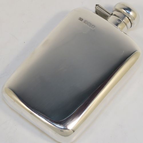 A heavy Sterling Silver whisky hip flask, having a plain shaped rectangular body with rounded shoulders, and a round hinged bayonet-fit lid. This elegant silver whisky flask was made by Robin Pringle of London in 1947. The dimensions of this fine hand-made silver hip whisky flask are length 15 cms (6 inches), width 8.5 cms (3.3 inches), depth 2.5 cms (1 inch), and it weighs approx. 250g (8 troy ounces).