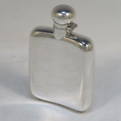 A very elegant Antique Edwardian Sterling Silver whisky hip flask, having a plain shaped rectangular body with rounded shoulders, and a round bayonet-fit lid. This handsome antique silver whisky flask was made by G. and J. W. Hawksley of Sheffield in 1909. The dimensions of this fine hand-made silver hip whisky flask are length 12 cms (4.75 inches), width 8 cms (3 inches), depth 2.5 cms (1 inch), and it weighs approx. 130g (4.2 troy ounces).   