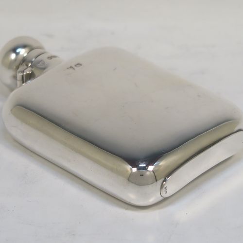 A very elegant Antique Edwardian Sterling Silver whisky hip flask, having a plain shaped rectangular body with rounded shoulders, and a round bayonet-fit lid. This handsome antique silver whisky flask was made by G. and J. W. Hawksley of Sheffield in 1909. The dimensions of this fine hand-made silver hip whisky flask are length 12 cms (4.75 inches), width 8 cms (3 inches), depth 2.5 cms (1 inch), and it weighs approx. 130g (4.2 troy ounces).   