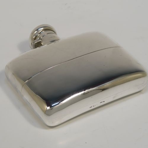 A heavy and very handsome Antique Sterling Silver whisky hip flask, having a plain shaped rectangular body with rounded shoulders, a bayonet-fit lid, and a pull-off cup with gold-gilt interior. This elegant antique silver whisky flask and cup were made by Deakin and Francis of Birmingham in 1917. The dimensions of this fine hand-made antique silver whisky flask are length 12 cms (4.75 inches), width 12 cms (4.75 inches), depth 4 cms (1.5 inches), and it weighs approx. 272g (8.8 troy ounces).   