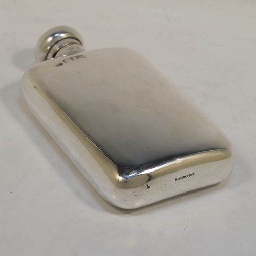 A very handsome Antique Sterling Silver whisky hip flask, having a plain shaped rectangular body with rounded shoulders, and a round hinged bayonet-fit lid. This elegant antique silver whisky flask was made by Mappin and Webb of London in 1918. The dimensions of this fine hand-made antique silver hip whisky flask are length 13.5 cms (5.3 inches), width 7.5 cms (3 inches), depth 2.5 cms (1 inch), and it weighs approx. 124g (4 troy ounces).  