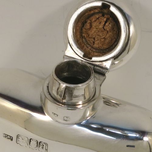 A very handsome Antique Sterling Silver whisky hip flask, having a plain shaped rectangular body with rounded shoulders, and a round hinged bayonet-fit lid. This elegant antique silver whisky flask was made by Mappin and Webb of London in 1918. The dimensions of this fine hand-made antique silver hip whisky flask are length 13.5 cms (5.3 inches), width 7.5 cms (3 inches), depth 2.5 cms (1 inch), and it weighs approx. 124g (4 troy ounces).