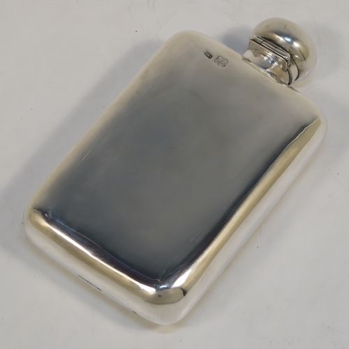 A very handsome Antique Sterling Silver whisky hip flask, having a plain shaped rectangular body with rounded shoulders, and a round hinged bayonet-fit lid. This elegant antique silver whisky flask was made by Mappin and Webb of London in 1918. The dimensions of this fine hand-made antique silver hip whisky flask are length 13.5 cms (5.3 inches), width 7.5 cms (3 inches), depth 2.5 cms (1 inch), and it weighs approx. 124g (4 troy ounces).