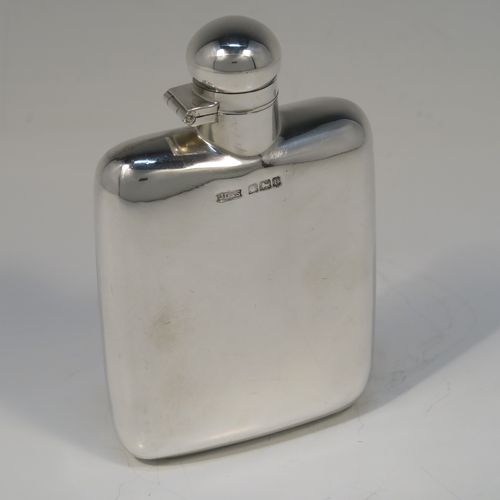 A handsome Antique Sterling Silver whisky hip flask, having a plain shaped rectangular body with rounded shoulders, and a hinged round bayonet-fit lid. This elegant silver hip flask was made by James Dixon of Sheffield in 1913. The dimensions of this fine hand-made antique silver whisky flask are length 12 cms (4.75 inches), width 7.5 cms (3 inches), depth 2 cms (0.75 inches) and it weighs approx. 105g (3.4 troy ounces).   