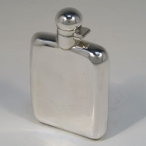 A handsome Antique Sterling Silver whisky hip flask, having a plain shaped rectangular body with rounded shoulders, and a hinged round bayonet-fit lid. This elegant silver hip flask was made by James Dixon of Sheffield in 1913. The dimensions of this fine hand-made antique silver whisky flask are length 12 cms (4.75 inches), width 7.5 cms (3 inches), depth 2 cms (0.75 inches) and it weighs approx. 105g (3.4 troy ounces).