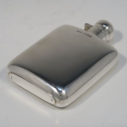 A handsome Antique Sterling Silver whisky hip flask, having a plain shaped rectangular body with rounded shoulders, and a hinged round bayonet-fit lid. This elegant silver hip flask was made by James Dixon of Sheffield in 1913. The dimensions of this fine hand-made antique silver whisky flask are length 12 cms (4.75 inches), width 7.5 cms (3 inches), depth 2 cms (0.75 inches) and it weighs approx. 105g (3.4 troy ounces).