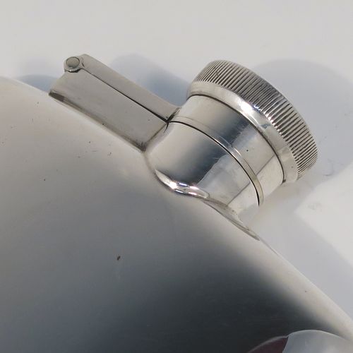 A handsome Sterling Silver whisky hip flask, having a plain shaped rectangular body with rounded shoulders, and a hinged bayonet-fit lid with knurled thumb-piece. This elegant silver whisky flask was made by James Dixon and Sons of Sheffield in 1944. The dimensions of this fine hand-made silver hip flask are length 12 cms (4.75 inches), width 8.5 cms (3.3 inches), depth 2 cms (0.75 inches) and it weighs approx. 139g (4.5 troy ounces).   