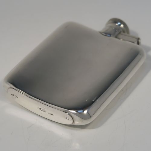 A handsome Sterling Silver whisky hip flask, having a plain shaped rectangular body with rounded shoulders, and a hinged bayonet-fit lid with knurled thumb-piece. This elegant silver whisky flask was made by James Dixon and Sons of Sheffield in 1944. The dimensions of this fine hand-made silver hip flask are length 12 cms (4.75 inches), width 8.5 cms (3.3 inches), depth 2 cms (0.75 inches) and it weighs approx. 139g (4.5 troy ounces).   