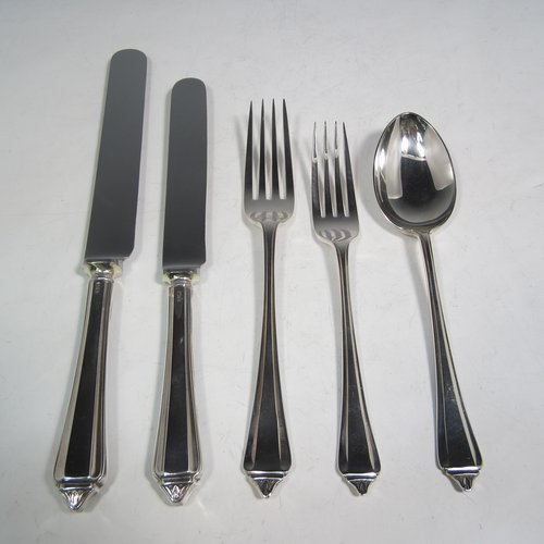 Sterling silver Belmont pattern flatware / cutlery service in original canteen, having 30 pieces in total, including 6 table forks, 6 dessert forks, 6 dessert spoons, 6 table knives, and 6 dessert knives. All made in Sheffield in 1939. The dimensions of this fine hand-made silver cutlery service are length of table fork 19 cms (7.5 inches), length of table knife 25.5 cms (10 inches), and the total weight is approx. 1,250g (40 troy ounces). Please note that the canteen has damage to the external veneer, and that the brass plaque on top of the box lid is monogrammed.