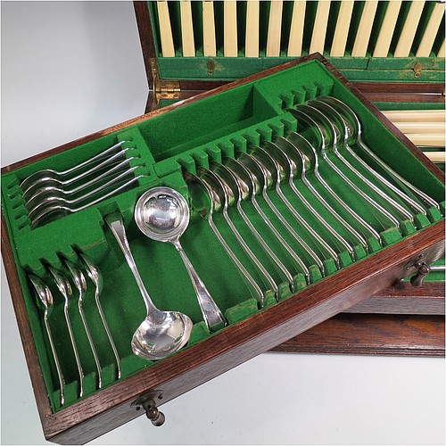 A very stylish Art Deco Sterling Silver Newlyn pattern flatware / cutlery service for nine people in original oak canteen, having 69 pieces total including 9 table forks, 9 dessert forks, 4 table spoons, 9 dessert spoons, 6 coffee spoons, 9 teaspoons, 9 bone-handled table knives, 9 bone-handled dessert knives, a pair of sauce ladles, and a 3-piece bone-handled carving set. All made by Frank Cobb an Co. Ltd., of Sheffield in 1936. The dimensions of this fine hand-made silver cutlery service are length of table fork 19 cms (7.5 inches), length of largest spoon 21 cms (8.25 inches), and the total weight is 2,170g (70 troy ounces).