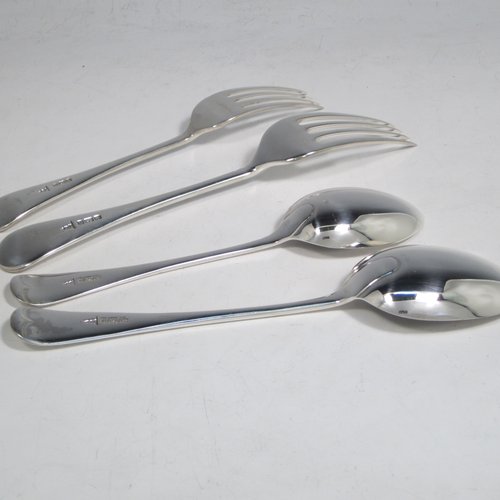An Antique Edwardian Sterling Silver Old English pattern flatware / cutlery service for twelve people in an original oak canteen, having 56 pieces total including 12 table forks, 12 dessert forks, 12 dessert spoons, and 12 table spoons (6 of which are smaller and 6 larger). All made by Walker & Hall of Sheffield in 1905. The dimensions of this fine hand-made antique silver cutlery service are length of table fork 20 cms (8 inches), length of largest spoon 21.5 cms (8.5 inches), and the total weight is 2,726g (88 troy ounces). Please note that this set does not include knives, and that the brass plaque on top of the box lid has a presentation inscription.