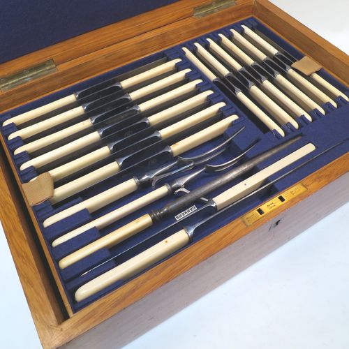 A very handsome and complete Antique Edwardian Silver Plated Old English pattern flatware / cutlery service for twelve people in original oak canteen with brass fitting, having 101 pieces total including 12 table forks, 12 dessert forks, 12 table / soup spoons, 12 dessert spoons, 12 tea spoons, 6 egg spoons, 12 bone-handled table knives, 12 bone-handled dessert knives, a butter knife, a condiment spoon, a pair of sugar nips, a pair of sauce ladles, a large soup ladle, and a 5-piece bone-handled carving set. All made by Harrison Brothers and Howson of Sheffield in ca. 1910.