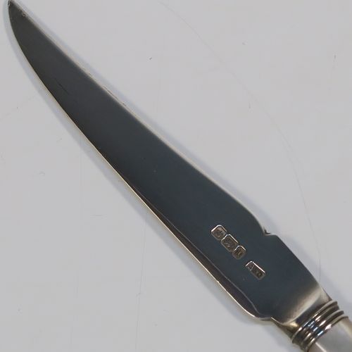 A very elegant set of six Antique Edwardian Sterling Silver and mother-of-pearl handled fruit fruit eating knives, having plain pointed-end bladed knives, all fitted into an original dark blue satin and velvet-line presentation box. This handsome silver fruit eater set was made by Allen and Darwin of Sheffield in 1903. The dimensions of this fine set of hand-made silver and mother-of-pearl fruit knives are length 16.5 cms (6.5 inches). Please note that the box is slightly damaged on one side.