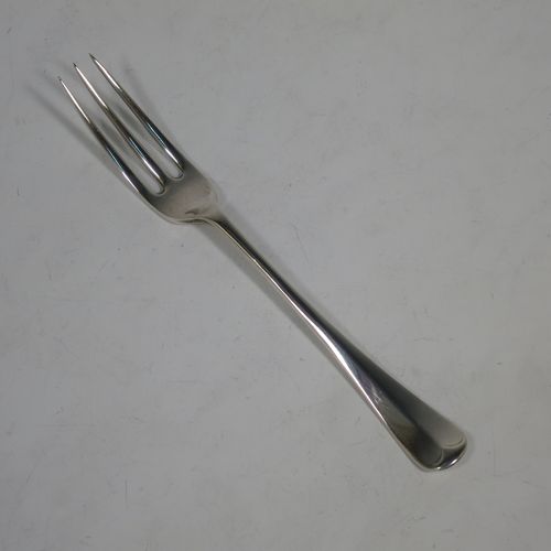A very handsome Antique Sterling Silver fruit set for six people, in the early Hanoverian pattern, with three-prong forks and pistol-handled kives with spatular blades, all fitted into an original wooden presentation box with dark blue satin and velvet-lined interior. Made by West and Sons of London in 1916. The dimensions of this fine hand-made silver fruit service are length of knife 20.5 cms (8 inches), and the length of the fork 16.5 cms (6.5 inches).