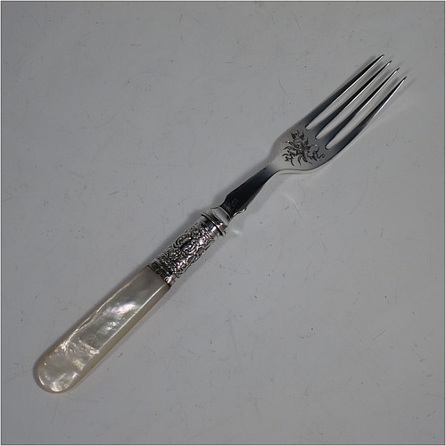 An Antique Victorian silver-plated and mother-of-pearl handled fruit set for twelve people, having hand-engraved tapering bladed knives and four-prong forks with floral decoration, with large hand-chased silver ferrules connecting the mother-of-pearl handles, all fitted into their original maroon satin and velvet-lined presentation box. The ferrules are of hallmarked sterling silver and are made by John Sanderson of Sheffield in 1897. The dimensions of this fine hand-made antique silver fruit service are length of knife 21 cms (8.25 inches), and the length of the fork 17.5 cms (7 inches).