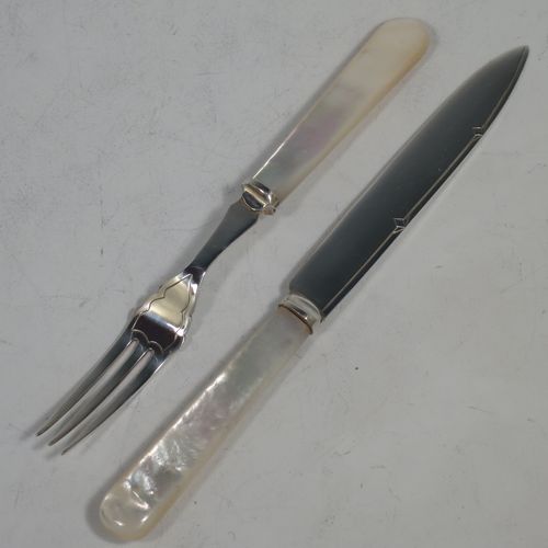 An Antique Edwardian Silver-plated and mother-of-pearl handled fruit set for twelve people. Having straight-sided pointed-end blade knives, and three-prong forks, with hand-engraved reed and diamond decoration, all fitted into an original oak wood presentation box with black velvet-lined interior. Made by Rattray and Co., of Dundee, Scotland, in ca. 1910. The dimensions of this fine hand-made antique silver-plated fruit service are length of knife 16.5 cms (6.5 inches), and the length of the fork 14.5 cms (5.75 inches).
