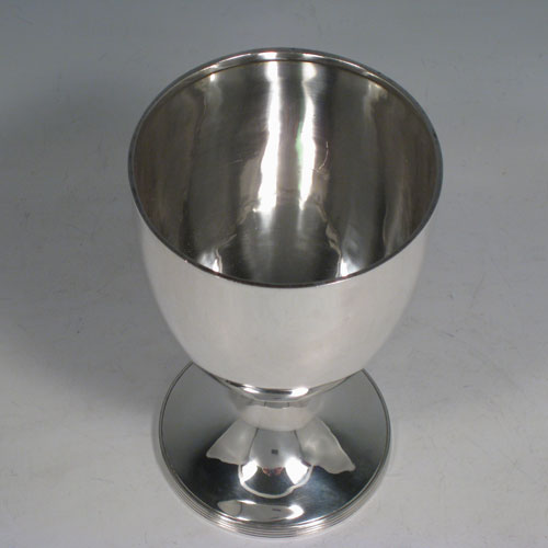 A handsome Antique Victorian Sterling Silver goblet, having a plain round body, sitting on a pedestal foot with a reeded border. Made by Hawksworth, Eyre and Co., of Sheffield in 1853. The dimensions of this fine hand-made antique silver goblet are height 15 cms (6 inches), diameter at lip 9 cms (3.5 inches), and it weighs approx. 197g (6.4 troy ounces).