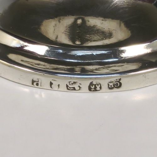 An elegant Antique Georgian Sterling Silver Coconut mounted goblet, with an applied vacant cartouche on one side, a plain round top border, and sitting on a plain round pedestal foot. This handsome antique silver and coconut goblet was made by Charles and David Reid of Newcastle in 1829. The dimensions of this fine hand-made silver and coconut goblet are height 11.5 cms (4.5 inches), and diameter of main body 9.5 cms (3.75 inches).