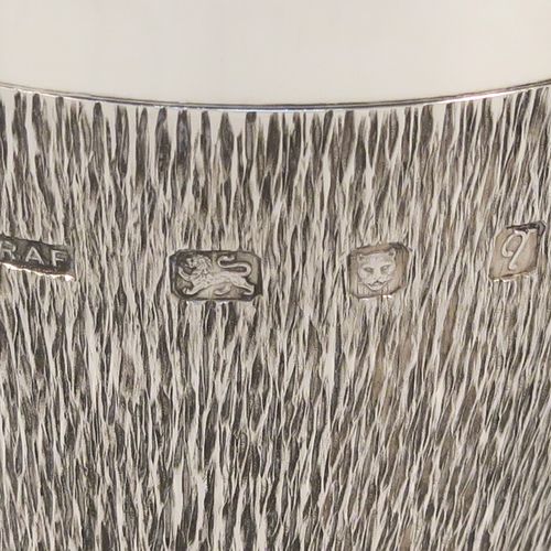 A very unusual modernistic style Sterling Silver sherry or fortified wine goblet, having a round tapering body with a hand-chased bark-like finish, a gold-gilt interior, and sitting on a plain round pedestal foot. This handsome silver sherry goblet was made by RAF of London in 1971. The dimensions of this fine hand-made silver goblet are height 11 cms (4.3 inches), diameter at lip 7.5 cms (3 inches), and it weighs approx. 164g (5.3 troy ounces).