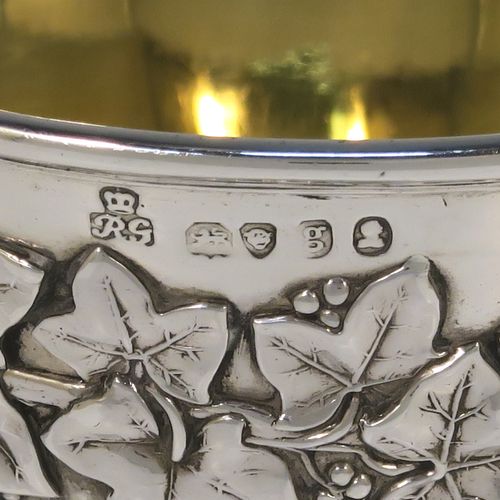 A beautiful Antique Georgian Sterling Silver Regency goblet, having a hand-chased Campagna style body, with an applied band of grapevine decoration, a half-fluted lower body, a gold-gilt interior, and sitting on a pedestal foot. This handsome antique silver Regency style goblet was made by Robert Garrard of London in 1822. The dimensions of this fine hand-made antique silver goblet are height 13.5 cms (5.3 inches), diameter at lip 9 cms (3.5 inches), and it weighs approx. 283g (9 troy ounces).