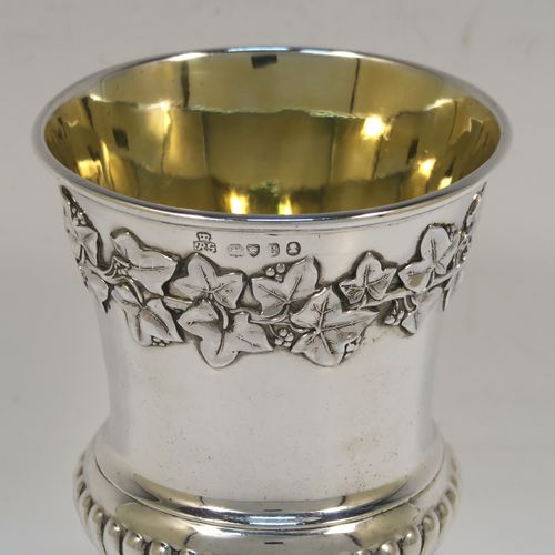 A beautiful Antique Georgian Sterling Silver Regency goblet, having a hand-chased Campagna style body, with an applied band of grapevine decoration, a half-fluted lower body, a gold-gilt interior, and sitting on a pedestal foot. This handsome antique silver Regency style goblet was made by Robert Garrard of London in 1822. The dimensions of this fine hand-made antique silver goblet are height 13.5 cms (5.3 inches), diameter at lip 9 cms (3.5 inches), and it weighs approx. 283g (9 troy ounces).