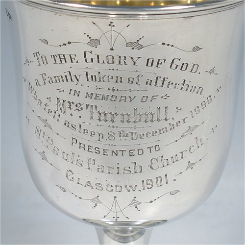 A large Antique Victorian Sterling Silver goblet, having a plain round baluster body with applied reeded border, hand-engraved on one side with a contemporaneous full inscription, a gold-gilt interior, and sitting on a pedestal foot. This handsome silver goblet was made by Walker & Hall of Sheffield in 1901. The dimensions of this fine hand-made antique silver goblet are height 19.5 cms (7.75 inches), diameter at lip 11 cms (4.25 inches), and it weighs approx. 375g (12 troy ounces).