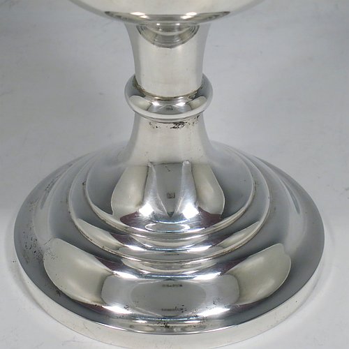 A large Antique Victorian Sterling Silver goblet, having a plain round baluster body with applied reeded border, hand-engraved on one side with a contemporaneous full inscription, a gold-gilt interior, and sitting on a pedestal foot. This handsome silver goblet was made by Walker & Hall of Sheffield in 1901. The dimensions of this fine hand-made antique silver goblet are height 19.5 cms (7.75 inches), diameter at lip 11 cms (4.25 inches), and it weighs approx. 375g (12 troy ounces).