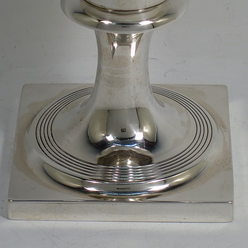 A very handsome Antique Georgian Sterling Silver heavy goblet, having a plain round tapering body with a gold-gilt interior, and sitting on a pedestal foot with reeded decoration and a square base. Made by Thomas Hobbs of London in 1811. The dimensions of this fine hand-made antique silver goblet are height 17 cms (6.75 inches), diameter at lip 9 cms (3.5 inches), and it weighs approx. 312g (10 troy ounces).