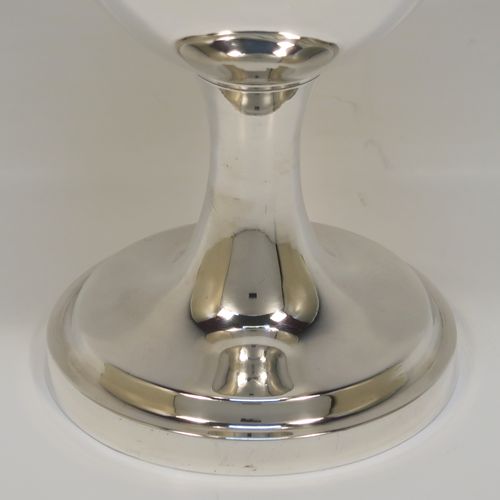 A handsome Antique Georgian Sterling Silver goblet, having a plain round bellied body, sitting on a plain round pedestal foot. This elegant silver goblet was made by Thomas Hobbs of London in 1814. The dimensions of this fine hand-made antique silver goblet are height 15 cms (6 inches), diameter at lip 8.5 cms (3.3 inches), and it weighs approx. 160g (5.2 troy ounces).