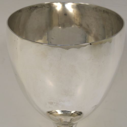 A large and very handsome Antique Georgian Sterling Silver goblet, having a plain round tapering body, sitting on a pedestal foot with a reeded border. This elegant antique silver goblet was made by Robert Scott II of Newcastle in ca. 1800. The dimensions of this fine hand-made antique silver goblet are height 16 cms (6.3 inches), diameter at lip 9.5 cms (3.75 inches), and it weighs approx. 194g (6.3 troy ounces).